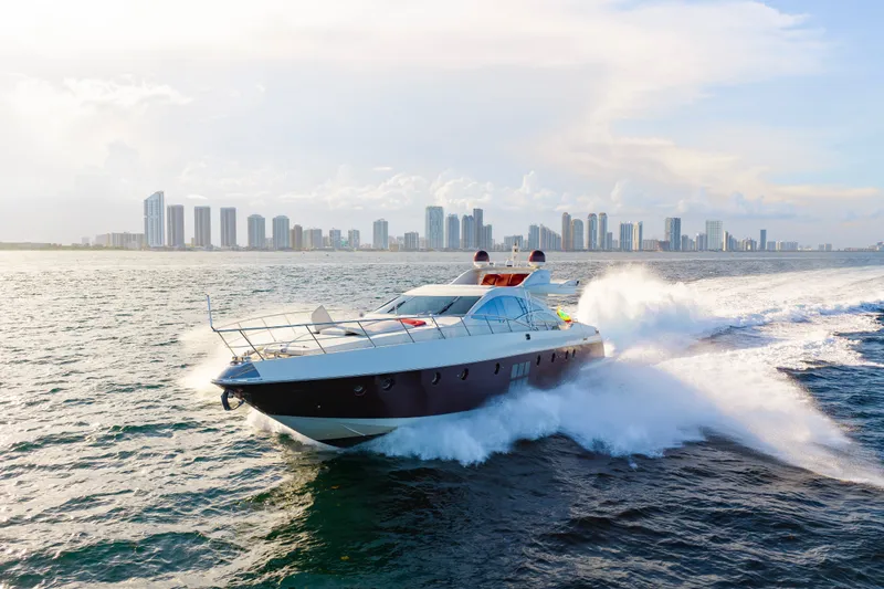 Slide: The Image of Luxury 2009 Azimut 86S yacht cruising near a city skyline on a sunny day. - 45