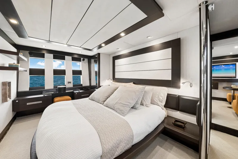 Slide: The Image of Luxurious bedroom interior of 2009 Azimut 86S yacht with ocean view windows. - 90
