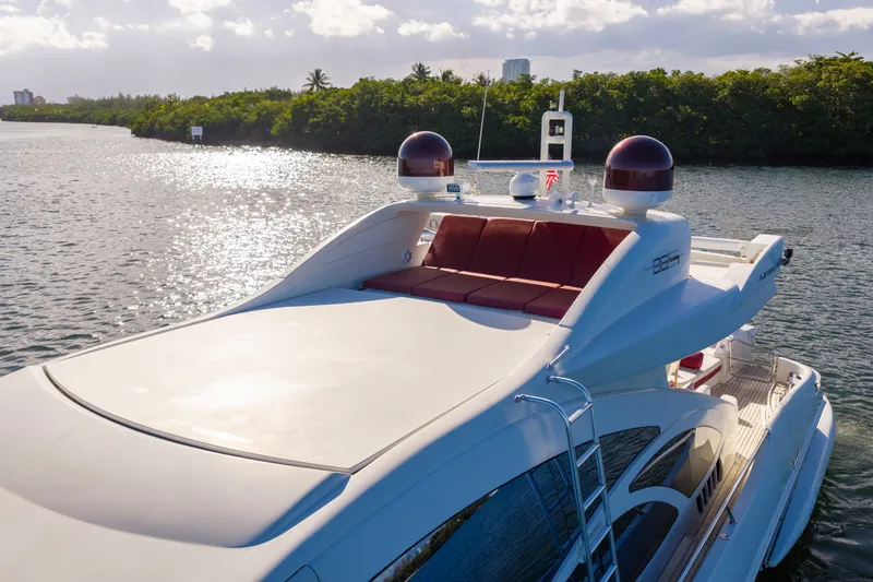 Slide: The Image of Luxurious 2009 Azimut 86S yacht on serene water, featuring sleek design and spacious deck. - 30