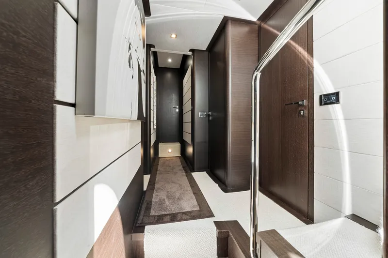 Slide: The Image of Luxurious interior hallway of a 2009 Azimut 86S yacht, featuring modern design elements. - 103