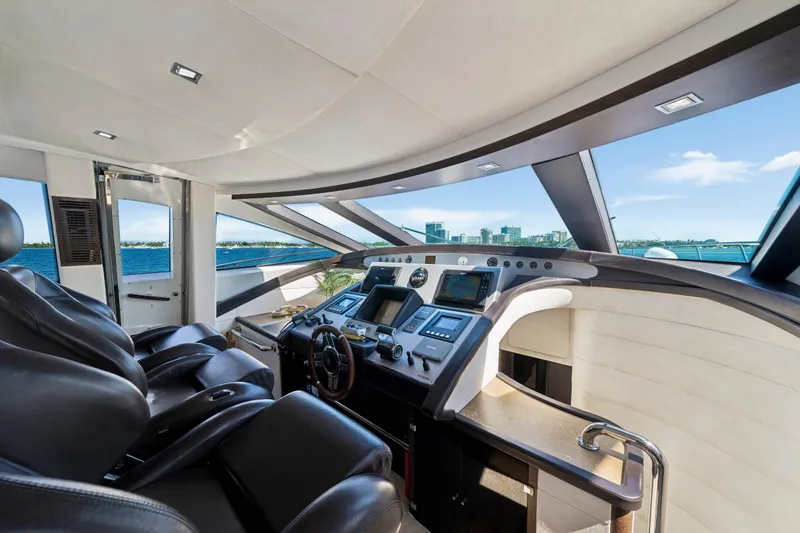 Slide: The Image of Luxurious 2009 Azimut 86S yacht cockpit with modern controls and panoramic ocean view. - 84