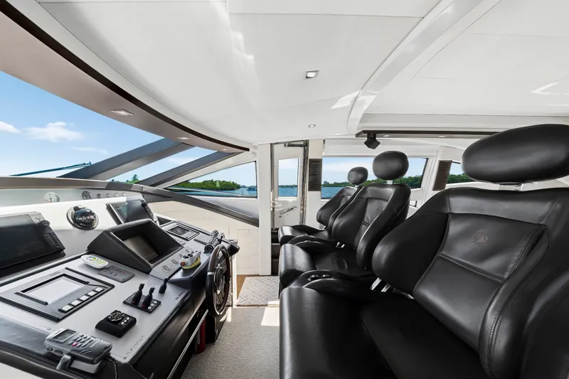 Slide: The Image of Luxurious interior of 2009 Azimut 86S yacht with sleek black leather seating. - 86