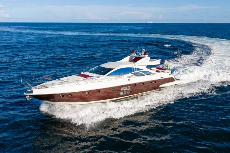 Slide: The Image of 2009 Azimut 86S yacht cruising on open blue ocean waters. - 31