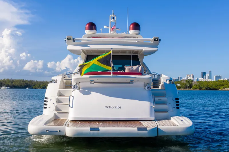 Slide: The Image of Luxury Azimut 86S yacht from 2009 on water, displaying Jamaican flag. - 22