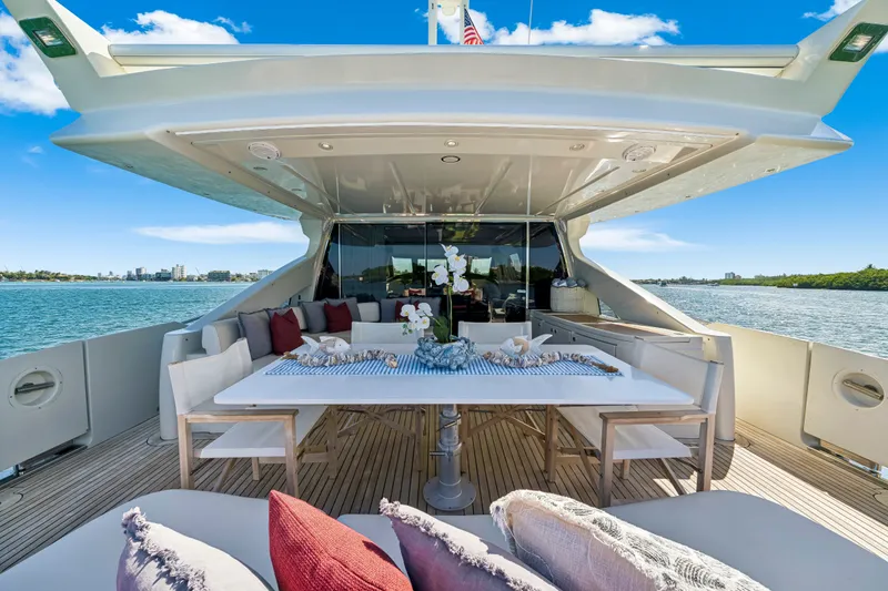 Slide: The Image of Luxurious 2009 Azimut 86S yacht deck with elegant dining area and scenic ocean view. - 59
