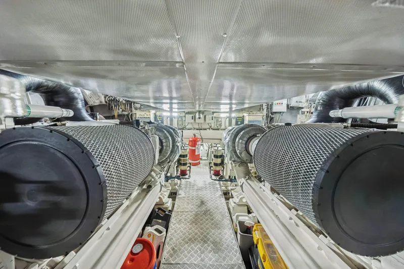 Slide: The Image of Engine room of a 2009 Azimut 86S yacht, featuring advanced machinery and equipment. - 117