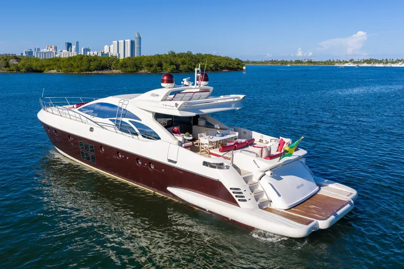 Slide: The Image of Luxurious 2009 Azimut 86S yacht cruising near a city skyline on a sunny day. - 16
