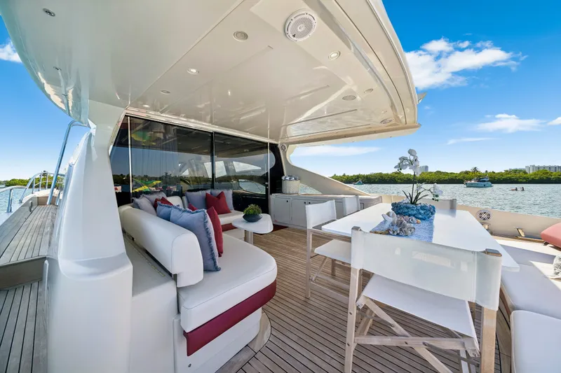 Slide: The Image of Luxurious 2009 Azimut 86S yacht deck with elegant seating and scenic water view. - 54