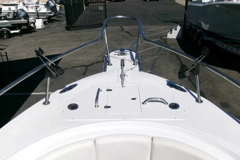 Slide: The Image of Bow view of 2008 Triumph 235 CC boat with rod holders and anchor setup. - 4