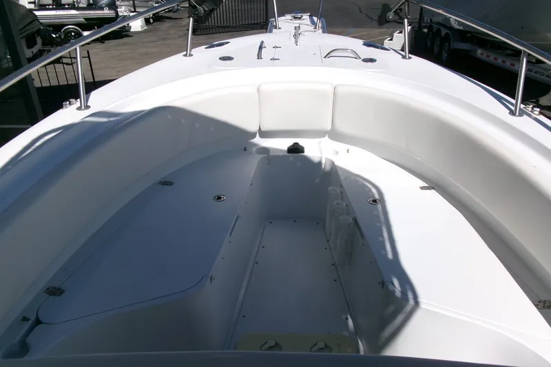 Slide: The Image of 2008 Triumph 235 CC boat interior with white seating and deck. - 5