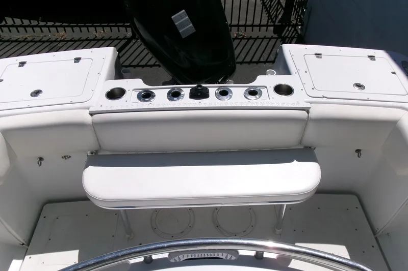 Slide: The Image of 2008 Triumph 235 CC boat interior with seating and storage compartments. - 19