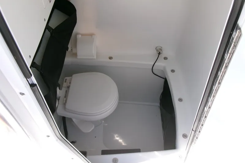 Slide: The Image of 2008 Triumph 235 CC boat interior with compact marine toilet. - 11