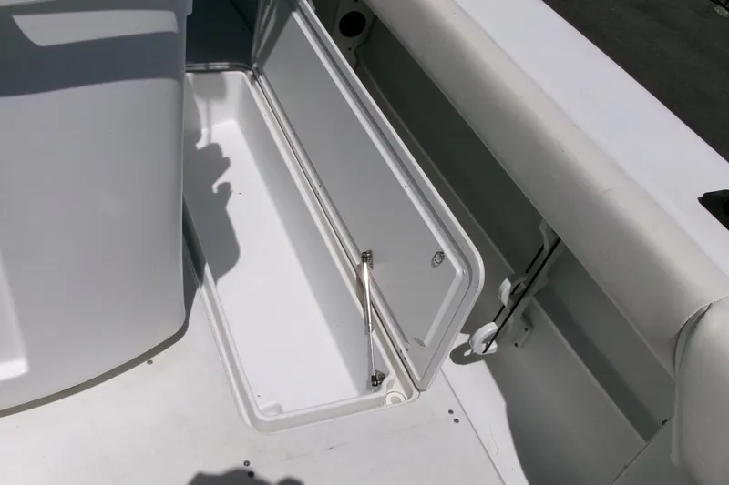Slide: The Image of 2008 Triumph 235 CC boat storage compartment with open hatch. - 28