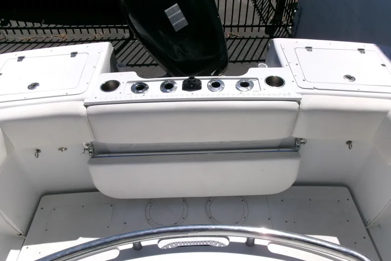 Slide: The Image of 2008 Triumph 235 CC boat interior with rod holders and storage compartments. - 20