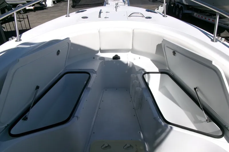 Slide: The Image of 2008 Triumph 235 CC boat interior with open storage compartments. - 6