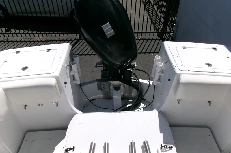 Slide: The Image of 2008 Triumph 235 CC boat stern with outboard motor and storage compartments. - 21