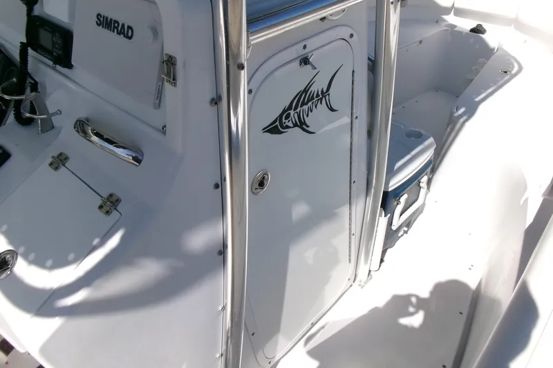 Slide: The Image of 2008 Triumph 235 CC boat interior with Simrad equipment and fish decal. - 10