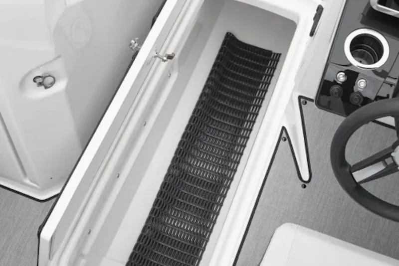 Slide: The Image of 2026 Yamaha Boats SX250 interior storage compartment and steering wheel detail. - 5