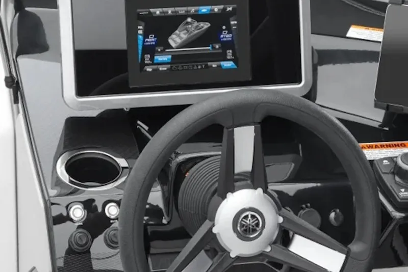 Slide: The Image of 2026 Yamaha Boats SX250 dashboard with steering wheel and touchscreen display. - 1