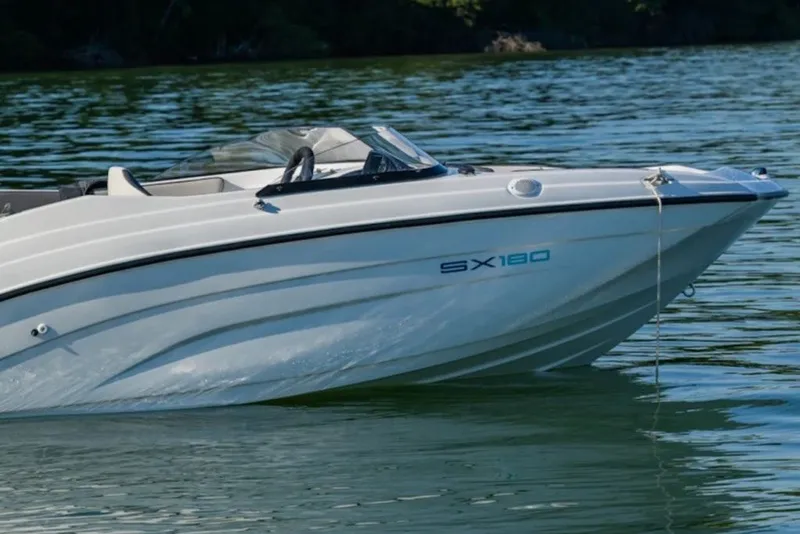 Slide: The Image of 2027 Yamaha Boats SX180 on calm water, showcasing sleek design and modern features. - 3