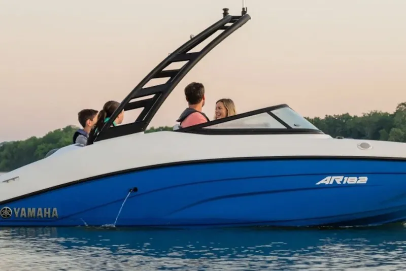 Slide: The Image of 2027 Yamaha Boats AR182 on water with passengers enjoying a scenic ride. - 3