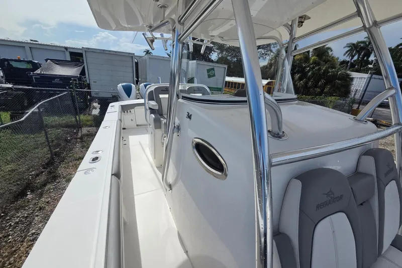 Slide: The Image of 2018 Regulator 34 Center Console boat with sleek design and spacious deck. - 17