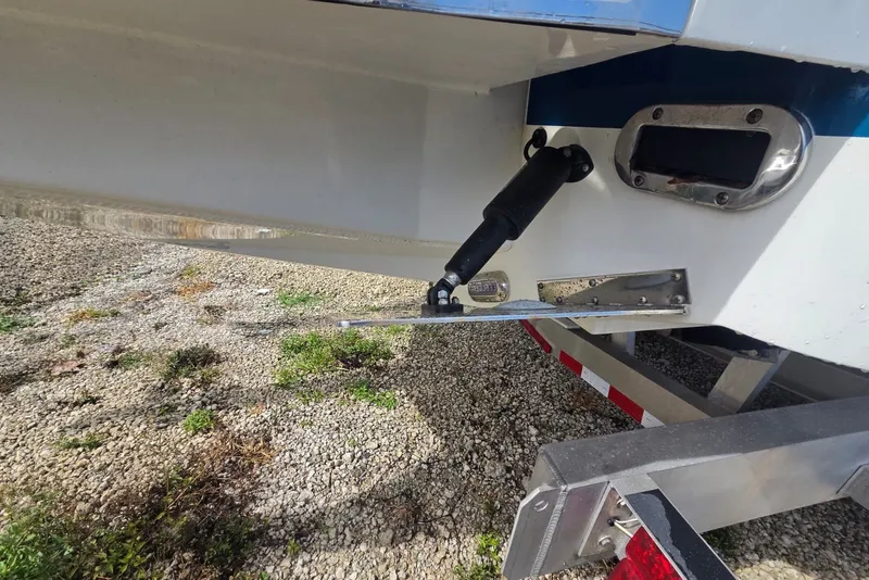 Slide: The Image of 2018 Regulator 34 Center Console boat with trim tab and hydraulic actuator. - 51