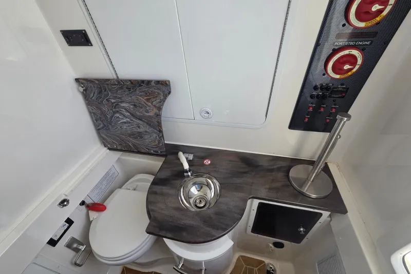Slide: The Image of Interior of 2018 Regulator 34 Center Console boat with sink and control panel. - 23
