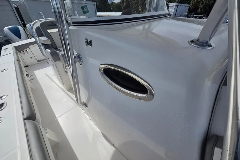 Slide: The Image of 2018 Regulator 34 Center Console boat interior with sleek design and seating. - 16