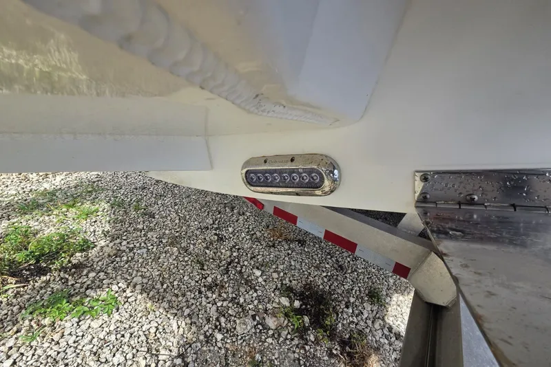 Slide: The Image of 2018 Regulator 34 Center Console boat detail with LED light and trailer. - 50