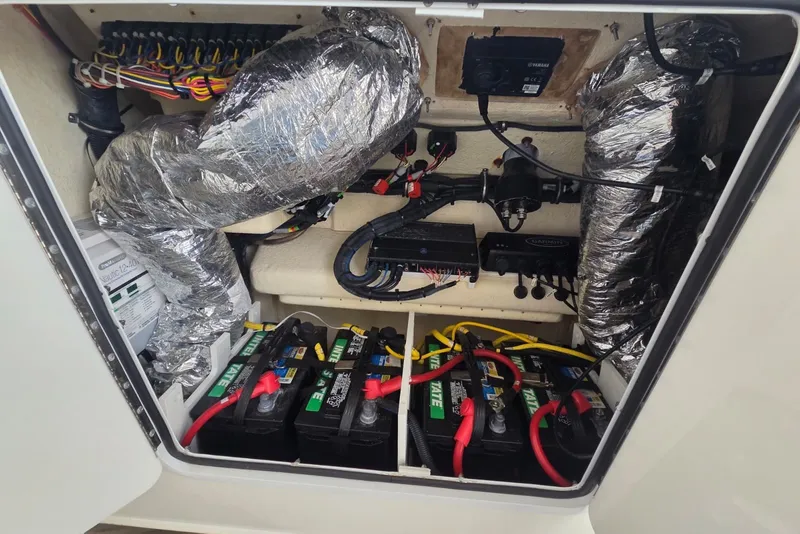 Slide: The Image of 2018 Regulator 34 Center Console boat electrical system with batteries and wiring. - 22