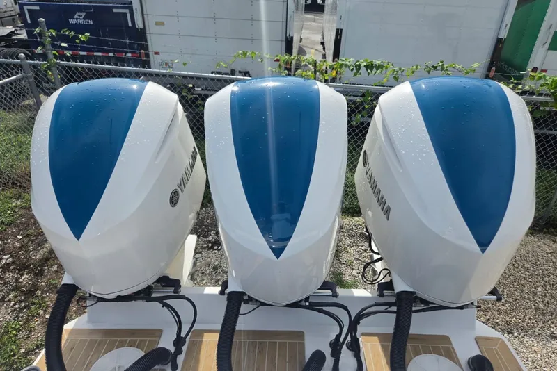 Slide: The Image of Triple Yamaha outboard engines on a 2018 Regulator 34 Center Console boat. - 32