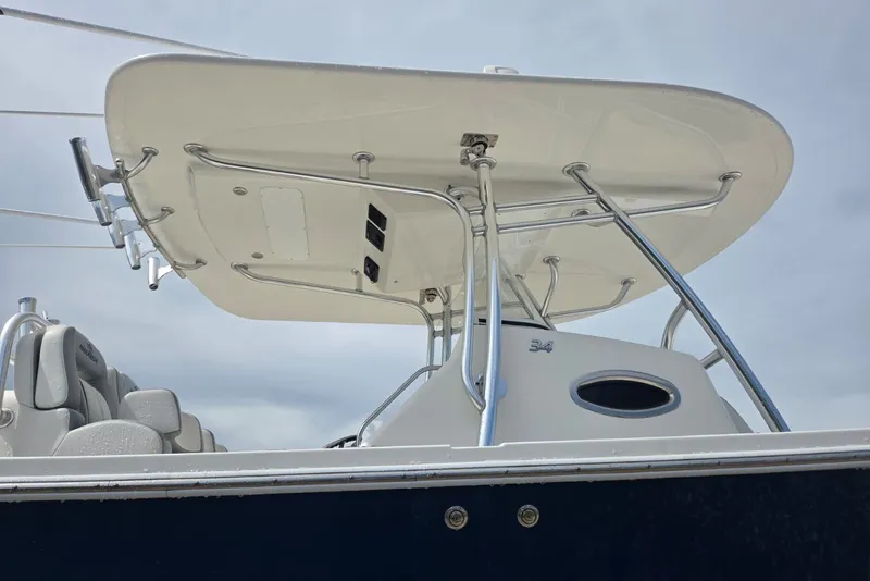 Slide: The Image of 2018 Regulator 34 Center Console boat with T-top and seating, viewed from below. - 54