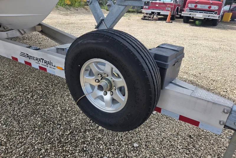Slide: The Image of Trailer with spare tire for 2018 Regulator 34 Center Console boat. - 59