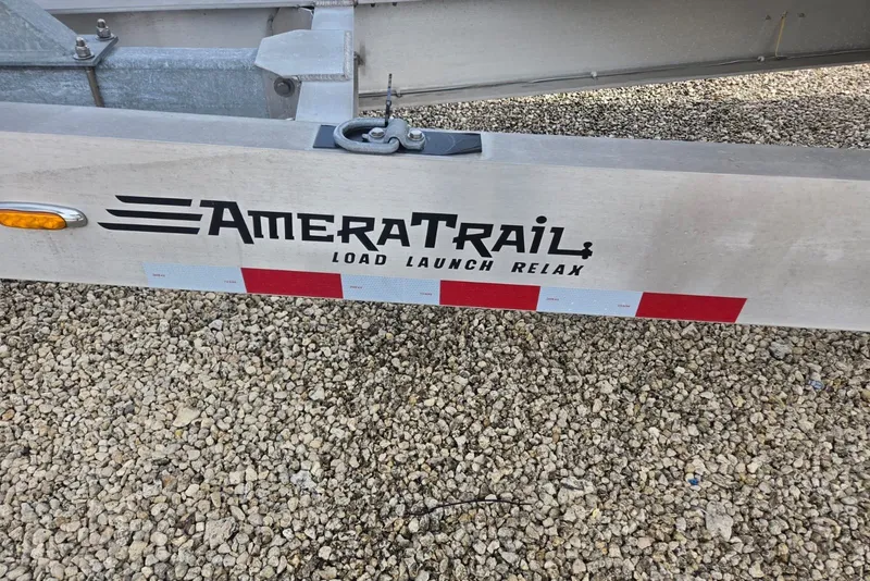 Slide: The Image of Trailer with AmeraTrail branding on gravel, suitable for 2018 Regulator 34 Center Console. - 64