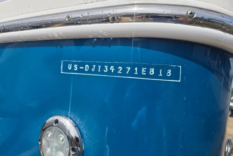 Slide: The Image of 2018 Regulator 34 Center Console boat with visible hull identification number. - 52