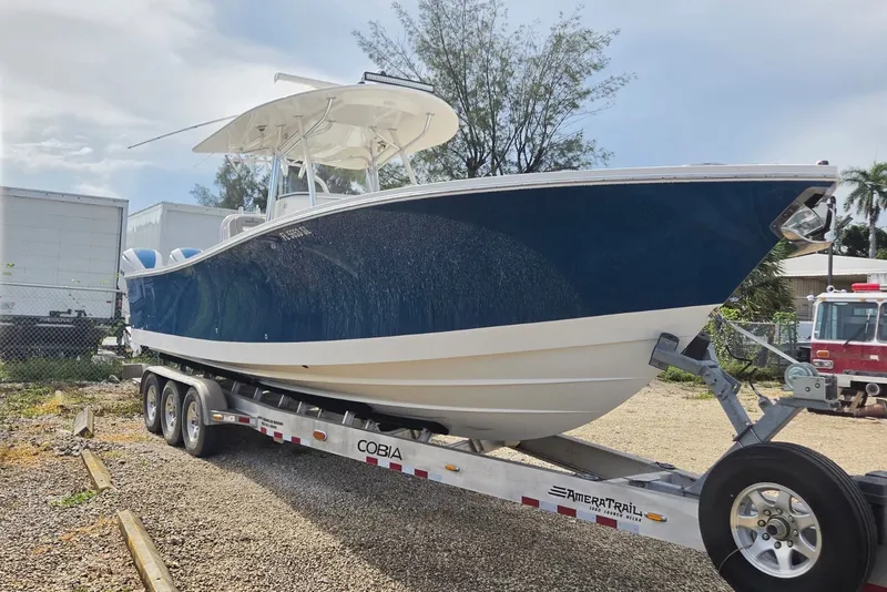Slide: The Image of 2018 Regulator 34 Center Console boat on trailer, parked outdoors. - 40
