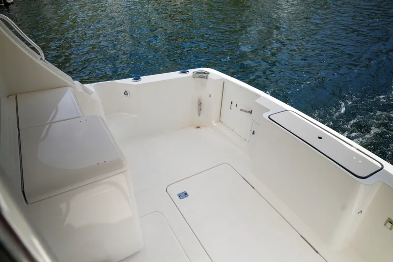 Slide: The Image of Spacious deck of 2014 Silverton 36 Convertible yacht, overlooking serene water. - 27