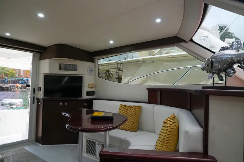 Slide: The Image of Interior of 2014 Silverton 36 Convertible yacht with cozy seating and modern decor. - 33