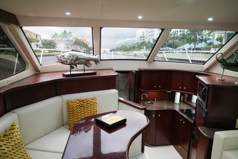 Slide: The Image of Luxurious interior of a 2014 Silverton 36 Convertible yacht with elegant wood finishes. - 24