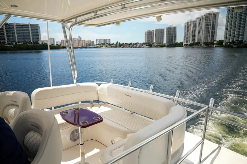 Slide: The Image of Luxurious 2014 Silverton 36 Convertible yacht cruising near city skyline. - 21