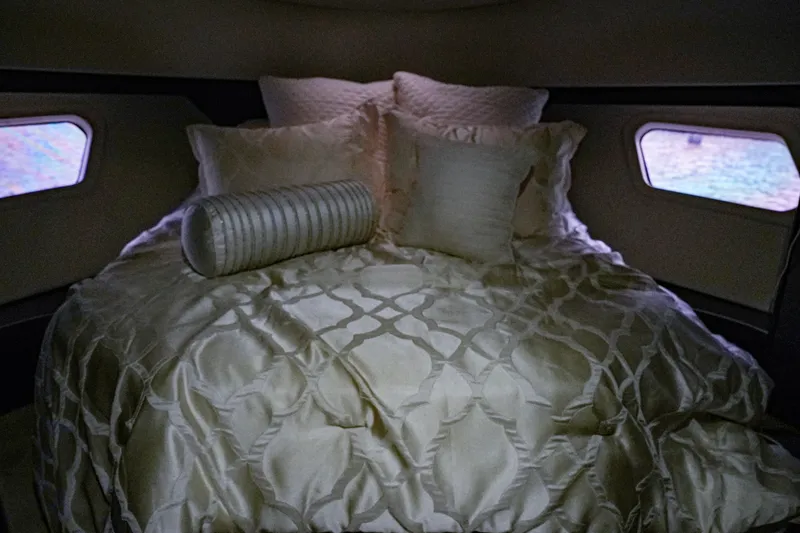 Slide: The Image of Luxurious bedroom interior of 2014 Silverton 36 Convertible yacht with elegant bedding. - 25