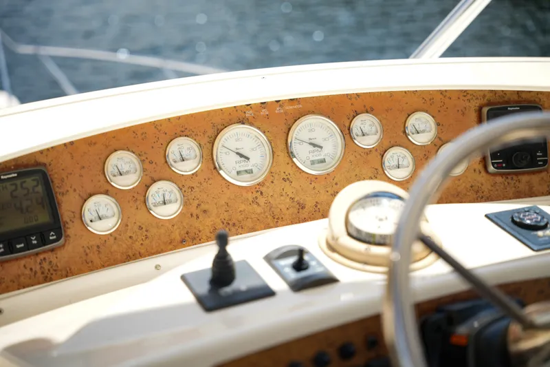 Slide: The Image of Dashboard of a 2014 Silverton 36 Convertible boat with gauges and controls. - 17