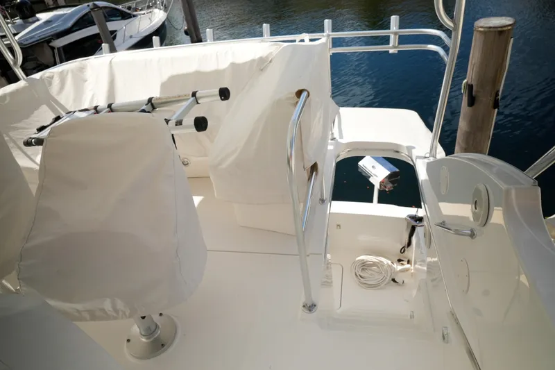 Slide: The Image of 2014 Silverton 36 Convertible yacht deck with covered seating and railing. - 11