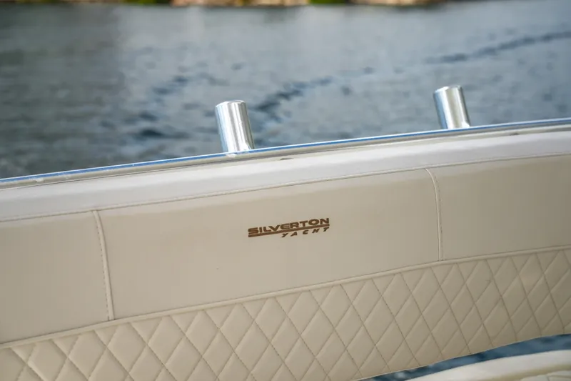 Slide: The Image of Silverton 36 Convertible 2014 yacht with quilted leather seating on a lake. - 20