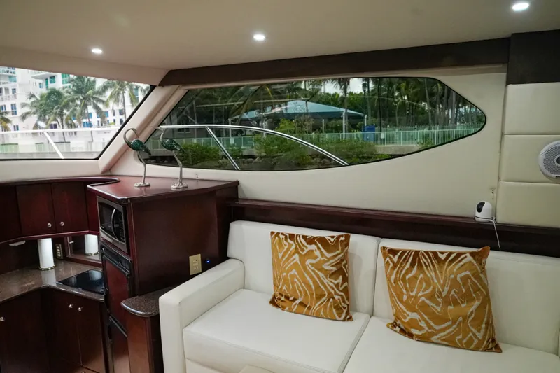 Slide: The Image of Interior of 2014 Silverton 36 Convertible yacht with elegant seating and modern amenities. - 26