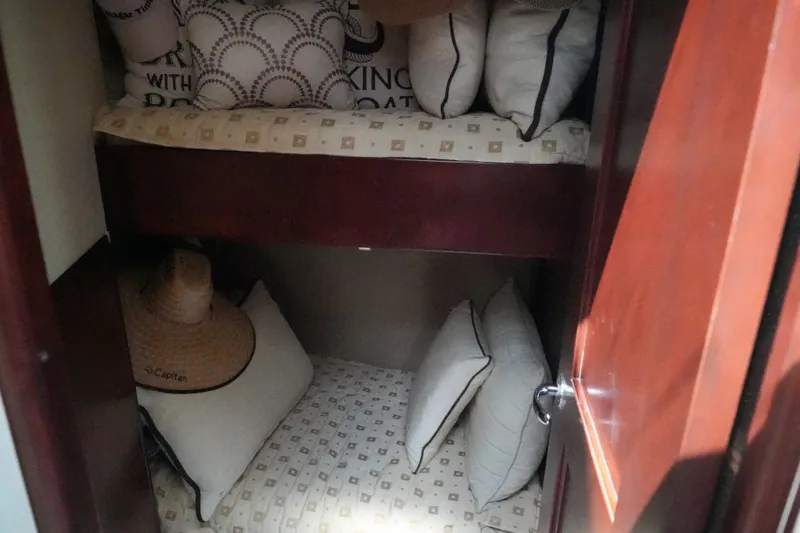Slide: The Image of Cozy cabin interior of 2014 Silverton 36 Convertible with bunk beds and pillows. - 12