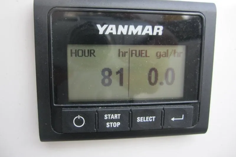 Slide: The Image of Yanmar engine display showing 81 hours and 0.0 fuel consumption on Jeanneau Sun Odyssey 380, 2024. - 26
