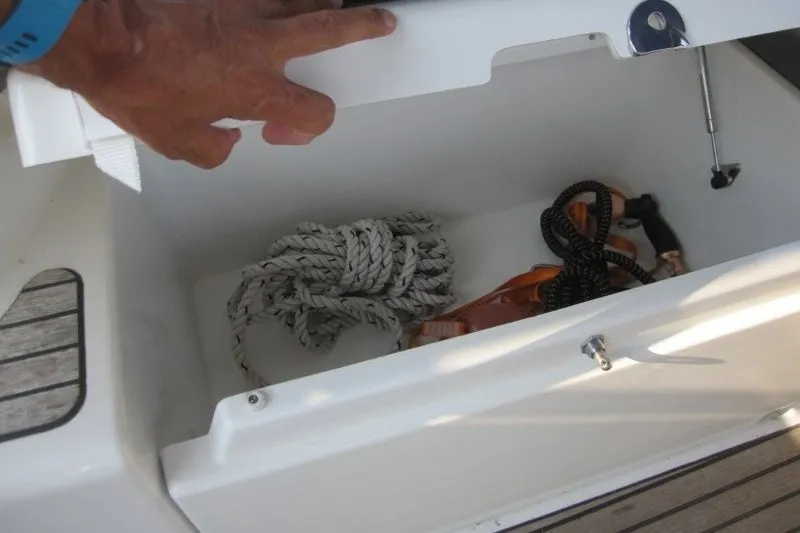 Slide: The Image of Storage compartment on 2024 Jeanneau Sun Odyssey 380 sailboat with ropes and accessories. - 46
