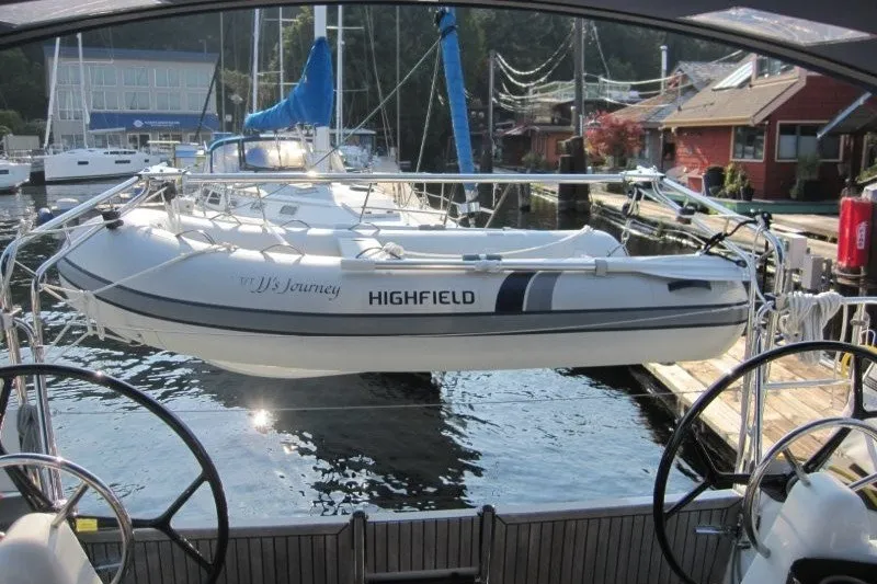 Slide: The Image of 2024 Jeanneau Sun Odyssey 380 with Highfield dinghy docked at marina. - 36